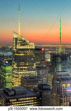 Stock Photo - View looking southwest at twilight from the Top of the Rock including the Bank of America Tower, Conde Nast Building, and other Manhattan skyscrapers. Fotosearch