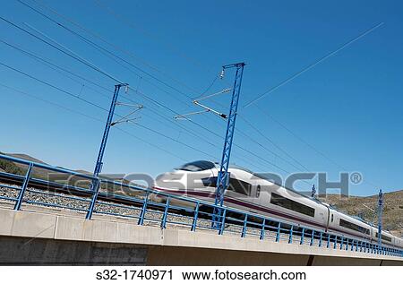 view of a high-speed train crossing a viaduct in Bubierca, Saragossa, Aragon, Spain, AVE Madrid Barcelona View Large Photo Image Stock Image - view of a high-speed train crossing a viaduct in Bubierca, Saragossa, Aragon, Spain, AVE Madrid Barcelona. Fotosearch