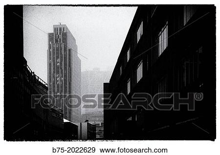 Stock Photo - View of a street at dusk in the City of London, England. Fotosearch