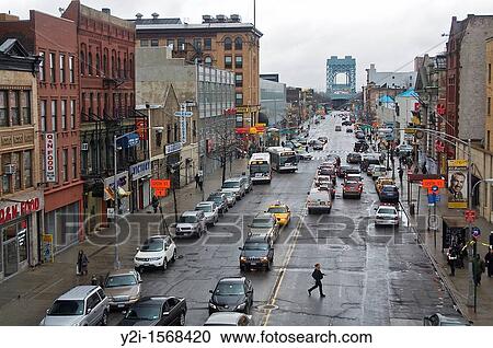Stock Image - View of a street from 125th Street Train Station, Harlem, Manhattan, New York City. Fotosearch