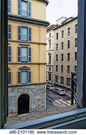 View of Apartment Buildings Through a Milan, Italy Window. View Large Photo Image Stock Photography - View of Apartment Buildings Through a Milan, Italy Window.. Fotosearch