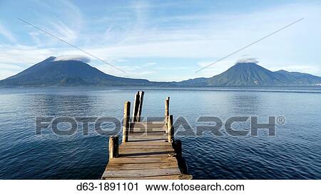 Stock Image - View of boat jettiy, Panajachel, early morning. Fotosearch