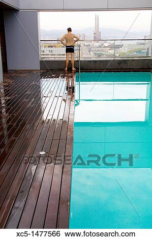 Stock Photograph - View of buildings in San Adria de Besos from the pool floor in a hotel, Barcelona, Catalonia, Spain. Fotosearch