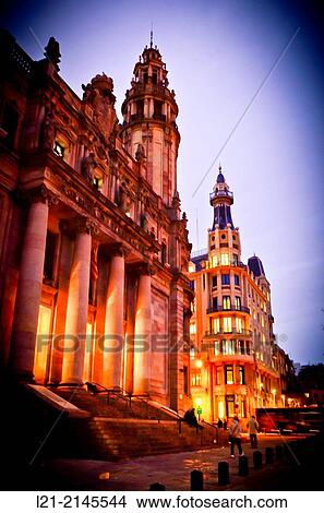 View of central post office building designed by Josep Goday Casals and Jaume Torres Grau at dusk, night. Pla? a Antonio L? pez, Barcelona, Catalonia, Spain. View Large Photo Image Picture - View of central post office building designed by Josep Goday Casals and Jaume Torres Grau at dusk, night. Pla? a Antonio L? pez, Barcelona, Catalonia, Spain.. Fotosearch