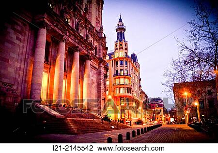 View of central post office building designed by Josep Goday Casals and Jaume Torres Grau at dusk, night. Pla? a Antonio L? pez, Barcelona, Catalonia, Spain. View Large Photo Image Stock Image - View of central post office building designed by Josep Goday Casals and Jaume Torres Grau at dusk, night. Pla? a Antonio L? pez, Barcelona, Catalonia, Spain.. Fotosearch