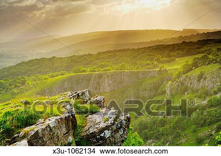 View of Cheddar Gorge on the edge of the Mendip Hills in Somerset, England, United Kingdom View Large Photo Image Picture - View of Cheddar Gorge on the edge of the Mendip Hills in Somerset, England, United Kingdom. Fotosearch