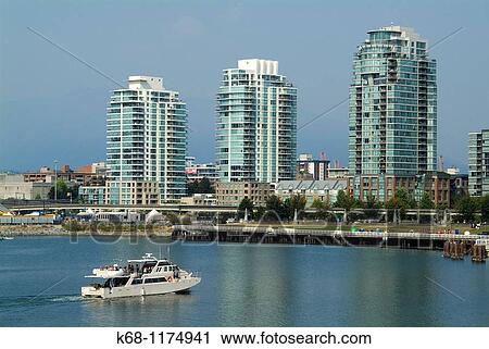 Stock Image - view of False Creek, Vancouver, BC, Canada from Canada House, at the Millenium project, the former Vancouver Olympic Village. Fotosearch