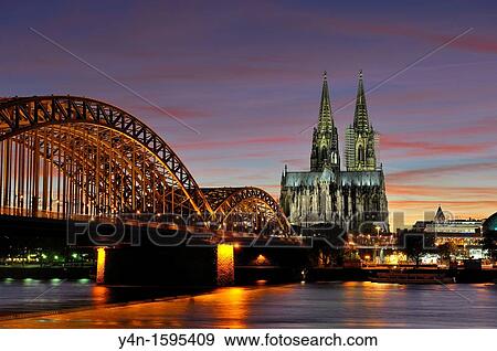 Stock Photo - View of Hohenzollern Bridge and Cathedral, Cologne, Germany. Fotosearch