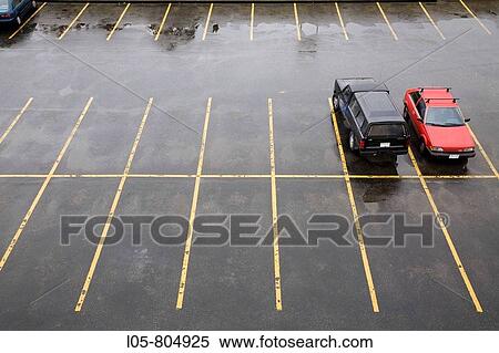 Stock Photography - View of parking spaces in the rain, Canada. Fotosearch