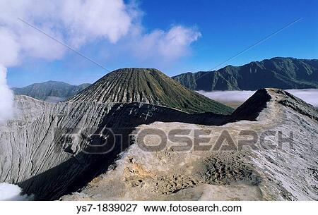 View of the caldera and active volcanoes from the top of Bromo volcano at sunrise, eastern Java, Indonesia View Large Photo Image Stock Photo - View of the caldera and active volcanoes from the top of Bromo volcano at sunrise, eastern Java, Indonesia. Fotosearch