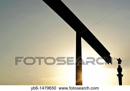 Stock Image - View of the Columbus monument from the Barcelona Harbor Moll de la fusta, Spain. Fotosearch