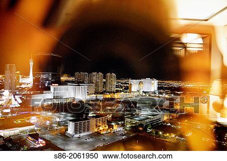 Stock Image - View of the Night Time Las Vegas Strip Skyline. Seen from a high floor of a Luxury Hotel Suite.. Fotosearch