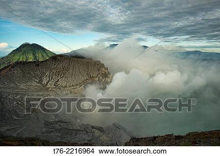 view of the smoking Kawah Ijen volcanic crater and lake, Java, Indonesia. View Large Photo Image Picture - view of the smoking Kawah Ijen volcanic crater and lake, Java, Indonesia.. Fotosearch