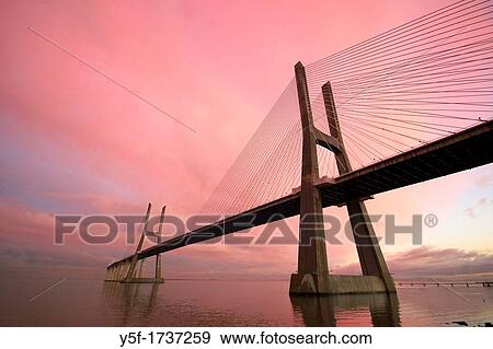View of Vasco da gama bridge on sunset, Lisbon, Portugal View Large Photo Image Stock Photo - View of Vasco da gama bridge on sunset, Lisbon, Portugal. Fotosearch