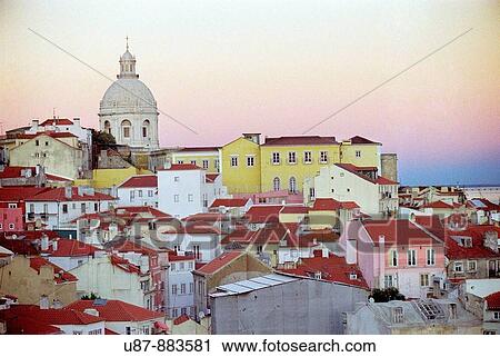 Stock Image - View on Alfama Quarter with National Pantheon of Santa Engracia in Background from Largo das Porta do Sol Viewpoint Lisbon Portugal. Fotosearch