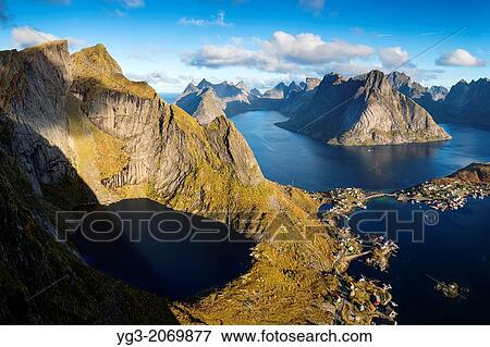 Stock Photo - View over Reine and Fjord landscape from summit of Reinebringen, Moskenesoy, Lofoten Islands, Norway.. Fotosearch
