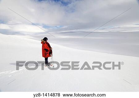 Stock Photo - View over snowy hills on Hardangervidda, Norway. Fotosearch