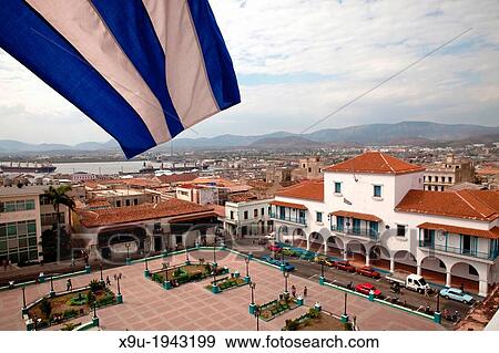 Stock Photo - view over the central square Parque Cespedes with the City Hall and Casa Velazquez, Museo de Arte Colonial in Santiago de Cuba, Cuba, Carribean.. Fotosearch