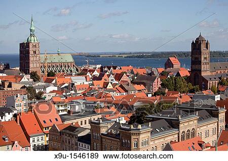 Stock Photo - view over the historic centre of Stralsund with Saint James's Church, St Nicolas's church and Ruegen island, Hanseatic City of Stralsund, Mecklenburg-Vorpommern, Germany. Fotosearch
