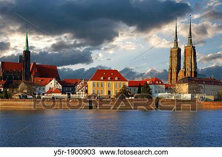 Stock Image - View over the Oder river to dome island, the Dome and the Church of the Holy Cross, Wroclaw county, Voivodeship Lower Silesian, Poland, Europe. Fotosearch