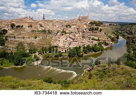 View over Toledo and Tajo River. Declared World Heritage city for the UNESCO. Castilla-La Mancha, Spain View Large Photo Image Stock Photo - View over Toledo and Tajo River. Declared World Heritage city for the UNESCO. Castilla-La Mancha, Spain. Fotosearch