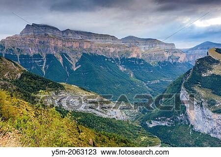 View over Valle de Broto towards Pena Mondaruego, Parque Nacional de Ordesa y Monte Perdido, Pyrenees, Huesca province, Aragon, Spain, Europe. View Large Photo Image Stock Image - View over Valle de Broto towards Pena Mondaruego, Parque Nacional de Ordesa y Monte Perdido, Pyrenees, Huesca province, Aragon, Spain, Europe.. Fotosearch
