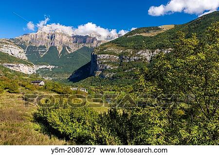 View over Valle de Broto towards Pena Mondaruego, Parque Nacional de Ordesa y Monte Perdido, Pyrenees, Huesca province, Aragon, Spain, Europe. View Large Photo Image Stock Photo - View over Valle de Broto towards Pena Mondaruego, Parque Nacional de Ordesa y Monte Perdido, Pyrenees, Huesca province, Aragon, Spain, Europe.. Fotosearch