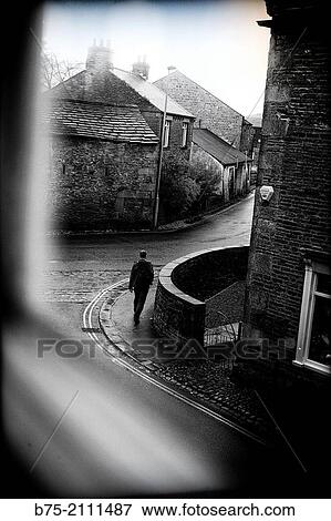 View through a window of a street with a man walking in Grassington, Yorkshire Dales, England, UK, Europe. View Large Photo Image Stock Photo - View through a window of a street with a man walking in Grassington, Yorkshire Dales, England, UK, Europe.. Fotosearch