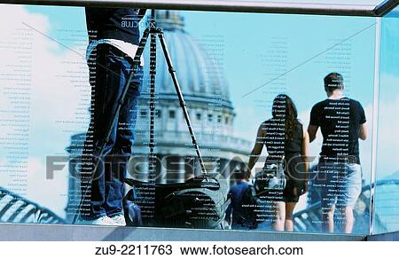 View through engraved glass of man with tripod and tourists crossing Millennium Bridge towards St Paul's Cathedral, London, England, Europe. View Large Photo Image Stock Image - View through engraved glass of man with tripod and tourists crossing Millennium Bridge towards St Paul's Cathedral, London, England, Europe.. Fotosearch
