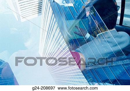 View thru back window of car (taxi). Businessman and woman discussing work. Reflection of overhead office towers View Large Photo Image Stock Photo - View thru back window of car (taxi). Businessman and woman discussing work. Reflection of overhead office towers. Fotosearch