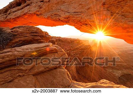 Stock Photo - View under Mesa Arch in Canyonlands National Park at sunrise.. Fotosearch