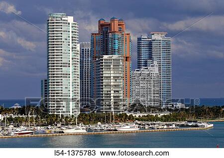 Stock Image - Views of Miami Florida skyline and harbor from departing cruise ship. Fotosearch