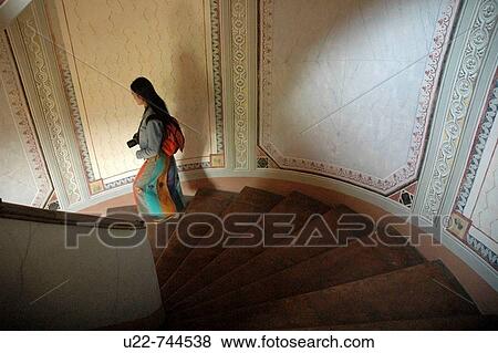 Vignola Modena, Italy, an Asian tourist along Palazzo Barozzi's winding staircase View Large Photo Image Stock Photo - Vignola Modena, Italy, an Asian tourist along Palazzo Barozzi's winding staircase. Fotosearch