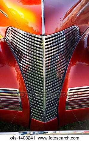 Stock Image - Vintage automotive style shines through on antique motorcar. Fotosearch
