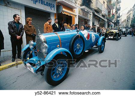Stock Image - Vintage car on Sitges streets. Barcelona-Sitges vintage car rally, Catalonia, Spain. Fotosearch