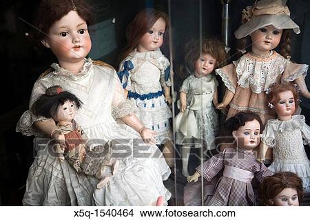 Vintage porcelain dolls exposed on a shop window, Cal? ada do Combro, Lisbon View Large Photo Image Picture - Vintage porcelain dolls exposed on a shop window, Cal? ada do Combro, Lisbon. Fotosearch