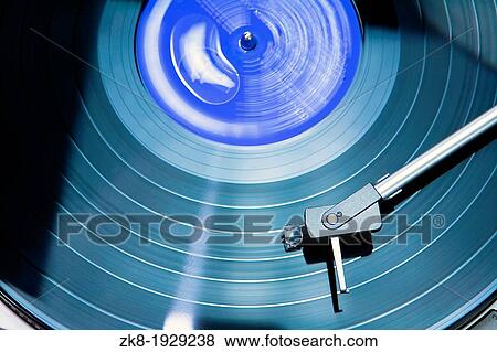 Vintage record player with spinning vinyl View Large Photo Image Stock Photo - Vintage record player with spinning vinyl. Fotosearch