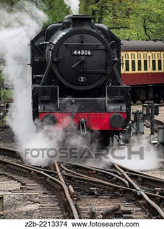 Vintage steam engine locomotive at Grosmont station, North Yorkshire Moors Railway, on the North Yorkshire Moors, Yorkshire, UK. View Large Photo Image Picture - Vintage steam engine locomotive at Grosmont station, North Yorkshire Moors Railway, on the North Yorkshire Moors, Yorkshire, UK.. Fotosearch