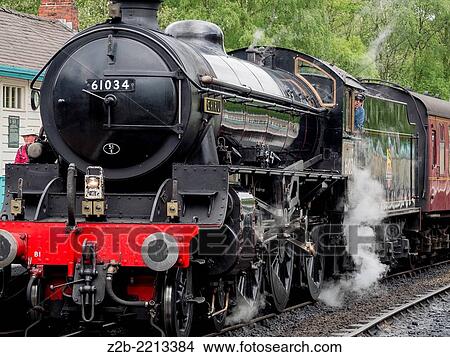 Vintage steam engine locomotive at Grosmont station, North Yorkshire Moors Railway, on the North Yorkshire Moors, Yorkshire, UK. View Large Photo Image Picture - Vintage steam engine locomotive at Grosmont station, North Yorkshire Moors Railway, on the North Yorkshire Moors, Yorkshire, UK.. Fotosearch