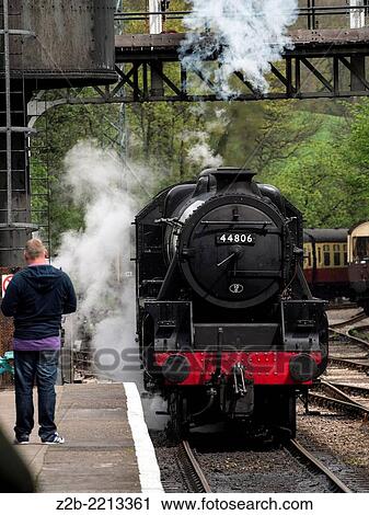 Vintage steam engine locomotive at Grosmont station, North Yorkshire Moors Railway, on the North Yorkshire Moors, Yorkshire, UK. View Large Photo Image Stock Image - Vintage steam engine locomotive at Grosmont station, North Yorkshire Moors Railway, on the North Yorkshire Moors, Yorkshire, UK.. Fotosearch