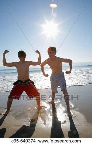 Virginia Beach, Virginia, USA, 2 boys playing on the beach, 13 years old. View Large Photo Image Picture - Virginia Beach, Virginia, USA, 2 boys playing on the beach, 13 years old.. Fotosearch