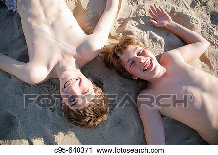 Virginia Beach, Virginia, USA, 2 boys playing on the beach, 13 years old. View Large Photo Image Stock Image - Virginia Beach, Virginia, USA, 2 boys playing on the beach, 13 years old.. Fotosearch