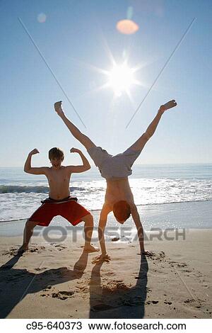 Virginia Beach, Virginia, USA, 2 boys playing on the beach, 13 years old. View Large Photo Image Stock Image - Virginia Beach, Virginia, USA, 2 boys playing on the beach, 13 years old.. Fotosearch