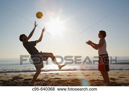 Virginia Beach, Virginia, USA, 2 boys playing on the beach, 13 years old. View Large Photo Image Stock Photo - Virginia Beach, Virginia, USA, 2 boys playing on the beach, 13 years old.. Fotosearch