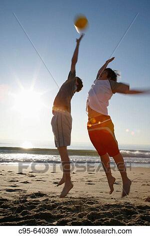 Virginia Beach, Virginia, USA, 2 boys playing on the beach, 13 years old. View Large Photo Image Stock Photo - Virginia Beach, Virginia, USA, 2 boys playing on the beach, 13 years old.. Fotosearch