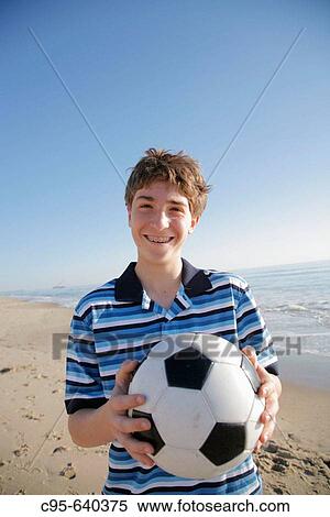 Virginia Beach, Virginia, USA, boy playing on the beach, 13 years old. View Large Photo Image Stock Photography - Virginia Beach, Virginia, USA, boy playing on the beach, 13 years old.. Fotosearch