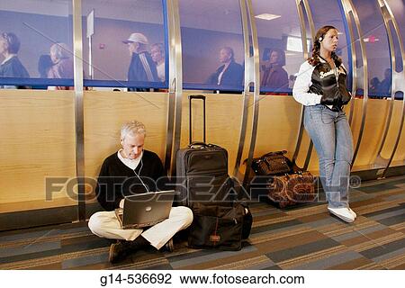 Virginia, Dulles Airport, boarding gate area, passengers, waiting, laptop computer, View Large Photo Image Stock Image - Virginia, Dulles Airport, boarding gate area, passengers, waiting, laptop computer,. Fotosearch
