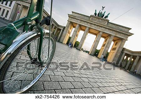 Visiting Brandenburg Gate biking, Berlin, Germany View Large Photo Image Stock Photograph - Visiting Brandenburg Gate biking, Berlin, Germany. Fotosearch