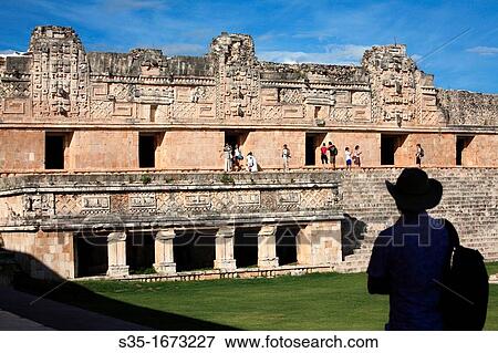 Visitor in the Nunnery Quadrangle Cuadrangulo de las Monjas in the ancient Mayan city of Uxmal Uxmal Mexico. View Large Photo Image Stock Photo - Visitor in the Nunnery Quadrangle Cuadrangulo de las Monjas in the ancient Mayan city of Uxmal Uxmal Mexico.. Fotosearch