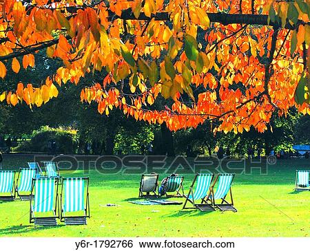 Visitors enjoy a sunny Autumn/ Fall day in St James's Park, London, England View Large Photo Image Stock Photograph - Visitors enjoy a sunny Autumn/ Fall day in St James's Park, London, England. Fotosearch